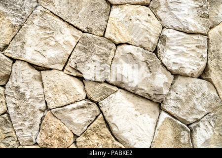 Hand geschnitzten Sandstein block Wand Textur Hintergrund Tapete. Stockfoto