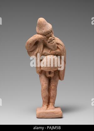 Terrakotta Statuette der Schauspieler. Kultur: Griechisch. Abmessungen: H. 4 3/4 in. (12,1 cm). Datum: Ende 5./Anfang des 4. Jh. v. Chr.. 14 Diese Zahlen sind zusammen in einer Beerdigung in Attika gefunden worden zu sein. Sie gehören zu den frühesten bekannten Statuetten von Akteuren und sind hervorragend ausgeführt und konserviert. Ursprünglich wurden sie bunt bemalt. Sie dokumentieren den Anfang von standardisierten Figuren und Masken, die die Popularität nicht einer bestimmten Figur, aber der Typen -- der alte Mann, der Slave, die Kurtisane, etc. -, die immer wieder in verschiedenen spielt erschienen. In der Mitte des vierten Jahrhunderts v. Chr. Stockfoto