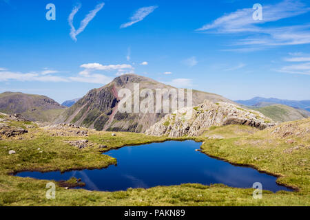 A pool and Great Gable from Corridor Route over Sty Head Pass in mountains of the English Lake District National Park in summer. Cumbria England UK Stockfoto