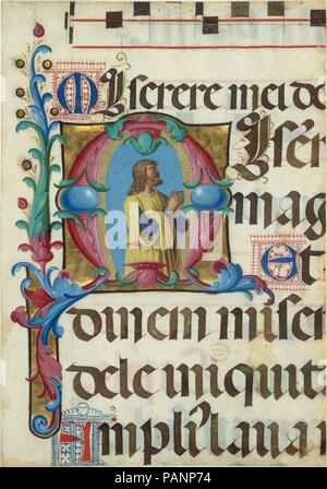 Manuskriptillumination mit David im Gebet in einem ersten M, aus einem Psalter. Artist: Girolamo dai Libri (Italienisch, Verona Verona 1474-1555). Kultur: Italienisch. Abmessungen: Insgesamt: 8 15/16 x 6 1/4 in. (22,7 x 15,9 cm) Beleuchtung: 3 3/16 x 3 1/8 in. (8,1 x 8 cm) Matte: 19 3/16 x 14 3/16 in. (48,7 x 36,1 cm). Datum: 1501-2. Wie der Gesang der Mönche in Girolamo dai Libri Miniatur ausgeführt für den gleichen Psalter (Nähe angezeigt), David erscheint hier im Gebet mit seinen Mund und sein Blick wandte sich gen Himmel. In vielen Bildern von David, Gott, dem Vater, über ihm erscheint als Objekt seiner inspirat Stockfoto