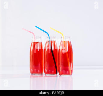 Drei farbigen Flaschen Stockfoto