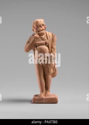 Terrakotta Statuette der Schauspieler. Kultur: Griechisch. Abmessungen: H. 4 3/4 in. (12,1 cm). Datum: Ende 5./Anfang des 4. Jh. v. Chr.. 14 Diese Zahlen sind zusammen in einer Beerdigung in Attika gefunden worden zu sein. Sie gehören zu den frühesten bekannten Statuetten von Akteuren und sind hervorragend ausgeführt und konserviert. Ursprünglich wurden sie bunt bemalt. Sie dokumentieren den Anfang von standardisierten Figuren und Masken, die die Popularität nicht einer bestimmten Figur, aber der Typen -- der alte Mann, der Slave, die Kurtisane, etc. -, die immer wieder in verschiedenen spielt erschienen. In der Mitte des vierten Jahrhunderts v. Chr. Stockfoto