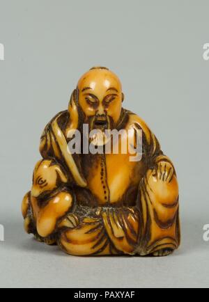 Netsuke der Sitzenden alten Mann mit einem Hund. Kultur: Japan. Abmessungen: H.1 1/4 in. (3.2 cm). Datum: 19. Museum: Metropolitan Museum of Art, New York, USA. Stockfoto