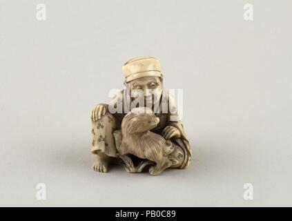 Netsuke der sitzenden Figur von einem Mann mit Hund. Kultur: Japan. Abmessungen: H.1 3/8 in. (3,5 cm); W. 1 3/16 in. (3 cm); D. 7/8 in. (2.2 cm). Datum: 19. Museum: Metropolitan Museum of Art, New York, USA. Stockfoto