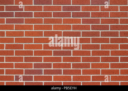 Leicht strukturierten rostig braune Farbe Mauer Hintergrund mit traditionellen laufende Anleihe Muster Stockfoto