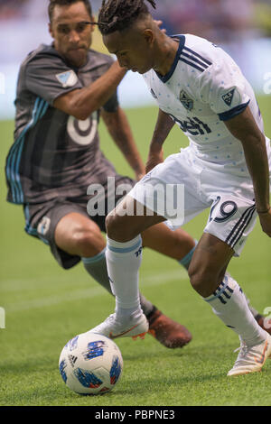 Vancouver, Kanada. 28. Juli 2018. Yordi Reyna (29) von Vancouver Whitecaps, in Aktion mit dem Ball. Final Score Vancouver 4, Minnesota 2. Vancouver Whitecaps vs Minnesota United FC BC Place. © Gerry Rousseau/Alamy leben Nachrichten Stockfoto