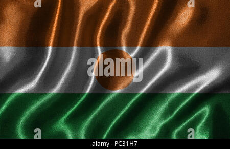 Niger Fahne - Fabric Flagge Niger Land-, Hintergrund- und Hintergrundbild von wehende Flagge von Textilien. Stockfoto