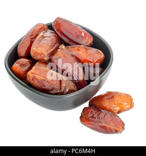 Schüssel Termine auf weißem Hintergrund - festliches Essen. Stockfoto
