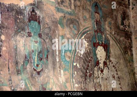 LANZHOU, Gansu Province, China - ca. Mai 2017: Wandmalereien an Anja Cave Tempel (UNESCO-Weltkulturerbe). Stockfoto