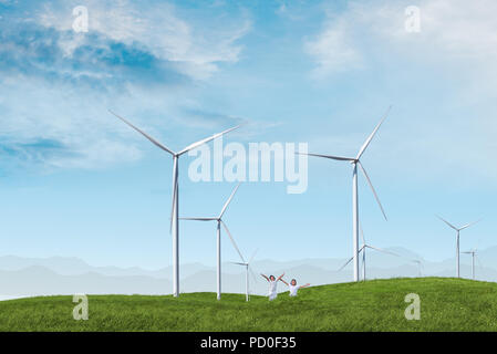 Kinder spielen im Wind Turbine Windturbine mit blauem Himmel Stockfoto