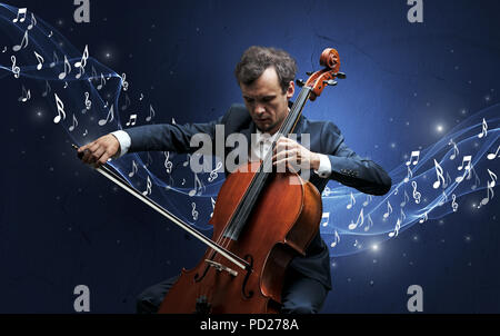 Lonely Komponist mit Cello und funkelnde Noten um Stockfoto