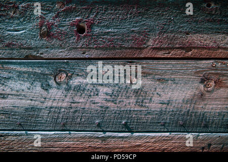 Verwittertes Holz Hintergrund Textur mit rot, lila, grün und braun Töne Stockfoto