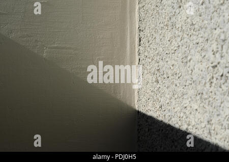 Naht zwischen verschiedenen Pflasterwand Texturen Stockfoto