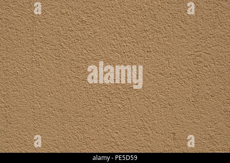 Beige texturierte bemalte Wand. Hintergrund der Architektur. Stockfoto