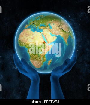 Eritrea auf dem Planeten Erde mit sichtbarer Landesgrenzen in den Händen im Raum. 3D-Darstellung. Stockfoto