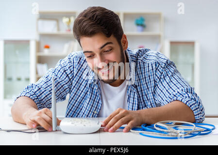 Frustriert junger Mann wegen der schwachen Internet Empfang Stockfoto