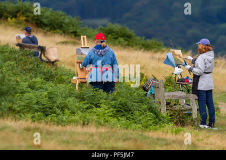 Künstler tutored draußen mit staffeleien von Lori Putnam, außerhalb der Malerei an der Kuh und Kalb Felsen mit Staffelei, Ilkley Moor Stockfoto