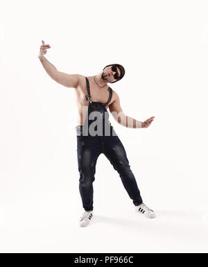 Netter Mann tanzen Breakdance im Studio. isoliert auf weißem Stockfoto