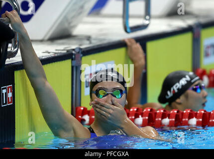 Jakarta, Indonesien. 21 Aug, 2018. Ikee Rikako von Japan reagiert, nachdem der Frauen 100 m Schmetterling endgültig vom Schwimmen im 18. asiatischen Spiele in Jakarta, Indonesien, Nov. 21, 2018. Ikee Rikako gewann die Goldmedaille. Credit: Fei Maohua/Xinhua/Alamy leben Nachrichten Stockfoto
