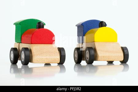 Two toy trains made from coloured blocks Stockfoto