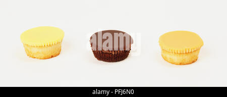 Drei Cupcakes in Folge Stockfoto