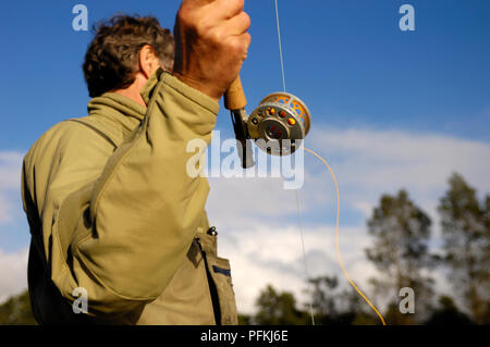 Der Mann mit Angelrute, close-up Stockfoto