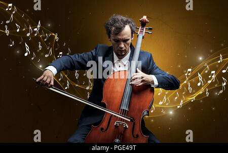 Lonely Komponist mit Cello und funkelnde Noten um Stockfoto