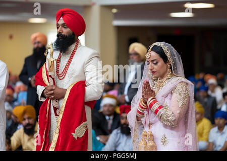 Ein Sikh Braut und Bräutigam an ihrer Hochzeit in South Richmond Hill, Queens, New York. Stockfoto