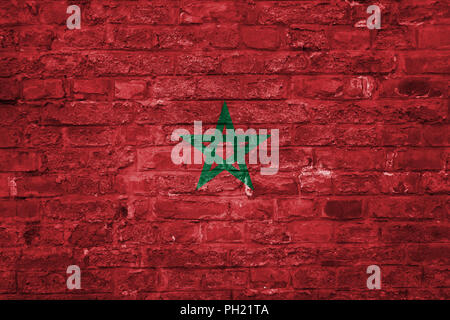 Flag of Morocco over an old brick wall background, surface Stockfoto