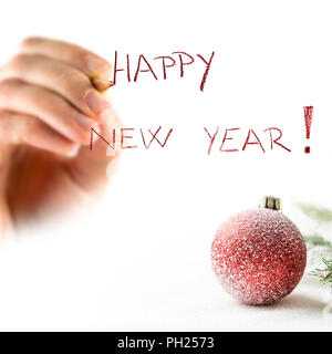 Schreiben Happy New Year Karte mit roter Verzierung. Stockfoto