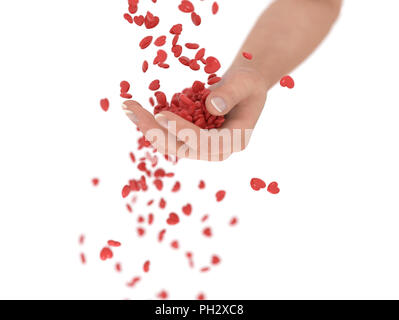 Rote Herzen fallen in die Hand Stockfoto