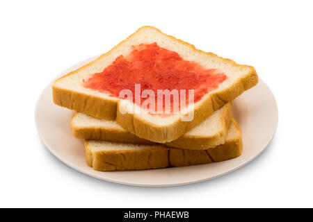 Stapel von geschnittenem Brot mit erdbeermarmelade in einer Platte Stockfoto