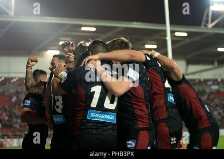 Merseyside, UK. 31. August 2018. Wigan feiern zählen die gewinnende versuchen, 31. August 2018, total Gottlosen Stadion, Merseyside, England; besser Super League Rugby, Super 8 s-3, St Helens v Wigan Warriors; Quelle: News Images/Alamy leben Nachrichten Stockfoto