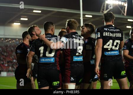 Merseyside, UK. 31. August 2018. Wigan feiern zählen die gewinnende versuchen, 31. August 2018, total Gottlosen Stadion, Merseyside, England; besser Super League Rugby, Super 8 s-3, St Helens v Wigan Warriors; Quelle: News Images/Alamy leben Nachrichten Stockfoto