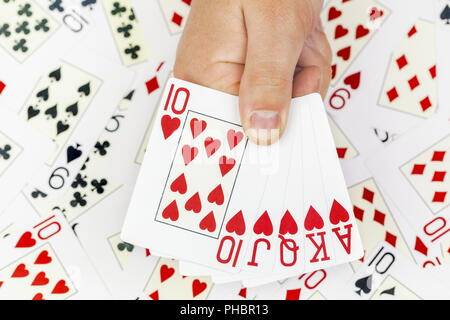 Poker Hand von Spielkarten auf Karten Hintergrund Stockfoto