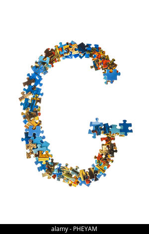 Buchstabe G aus Puzzleteile Stockfoto