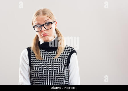 Traurig nerdy Frau Stockfoto