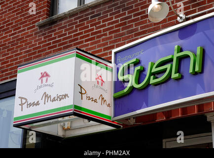 Sushi Restaurant und Pizzeria Seite an Seite in Montreal Stockfoto