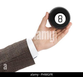 Hand mit Magic billardkugel Nr. 8 Stockfoto