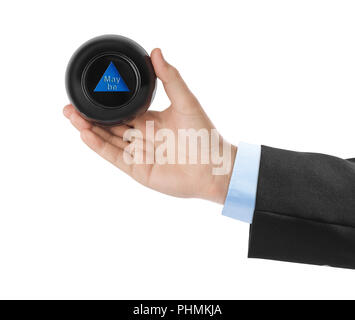 Magic Ball mit Vorhersage vielleicht in der Hand Stockfoto