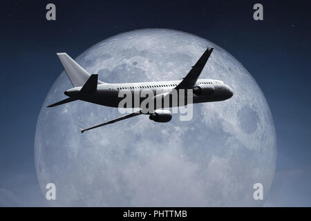 Ein Flugzeug und der Mond Stockfoto