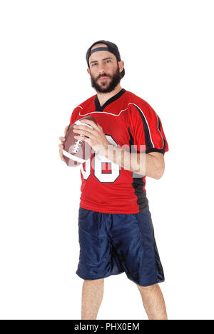 Junge Fußballspieler mit dem Fußball in seiner Hand. Stockfoto