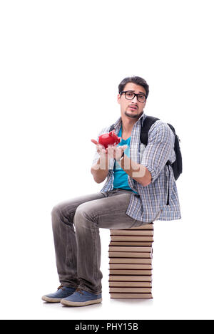 Junge Studentin auf Buch sitzen Stack auf Weiß Stockfoto