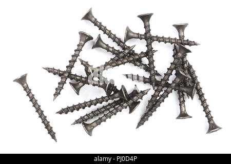 Schwarze Schrauben auf weißem Hintergrund closeup isoliert. Ansicht von oben. Stockfoto