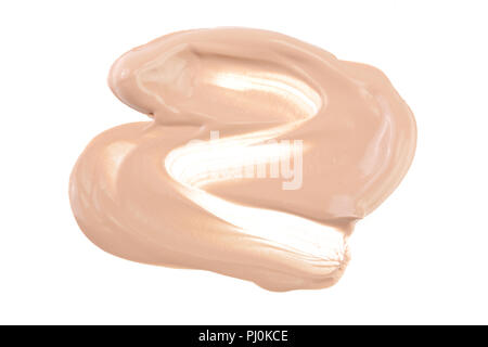 Beige Liquid Foundation Make-up auf weißem Hintergrund. Stockfoto