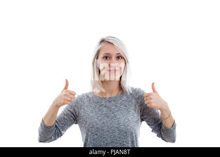 Begeisterte junge Frau, die ein doppeltes Daumen hoch Geste auf weißem Hintergrund. Stockfoto