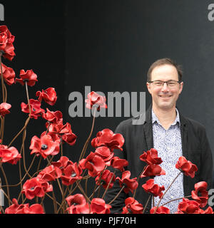 Manchester, Großbritannien. 7. September 2018. Die ikonischen poppy Skulptur Wave von Designer Tom Piper am IWM in Richtung Norden. Dies ist die abschließende Darstellung der Welle als Teil von 14-18 gedenken. Es ist das erste Mal, dass Manchester war Gastgeber eines dieser Kunstwerke. Die Installation "Blut fegte Länder und Meere der roten Mohnblumen ein originelles Konzept von Künstler Paul Cummins und Installation, der von Tom Piper. Die Installation wurde ursprünglich an der HM Tower von London, wo 888,246 Mohnblumen angezeigt wurden. Credit: MediaWorldImages/Alamy leben Nachrichten Stockfoto