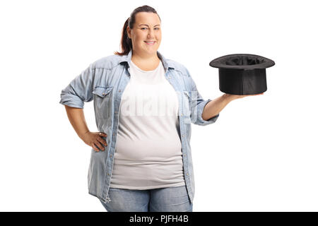 Frau mit einem Zauberer Hut und lächelnd auf weißem Hintergrund Stockfoto