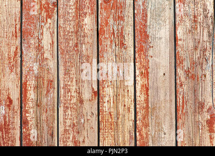 Alte Holz- Hintergrund der vertikalen Bretter mit Peeling rote Farbe Stockfoto