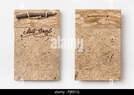 Geschäftskonzept - Blick von Oben auf die alten Vintage handmade Notebook mit Holz Bleistift auf Hintergrund für die Modellerstellung Stockfoto